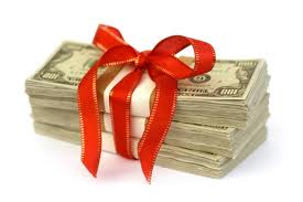 A photograph of a bundle of cash with a bow tied around it.